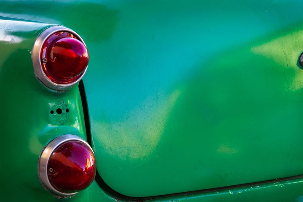Detail of two red tail lights on classic green car in Trinidad-Cuba art print by Janis Miglavs for $57.95 CAD